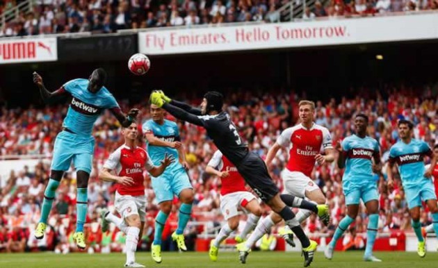 Cheikhou Kouyate rises high to beat summer signing Petr Cech to the ball and head the visitors into a 1-0 lead in the 43rd minute yesterday