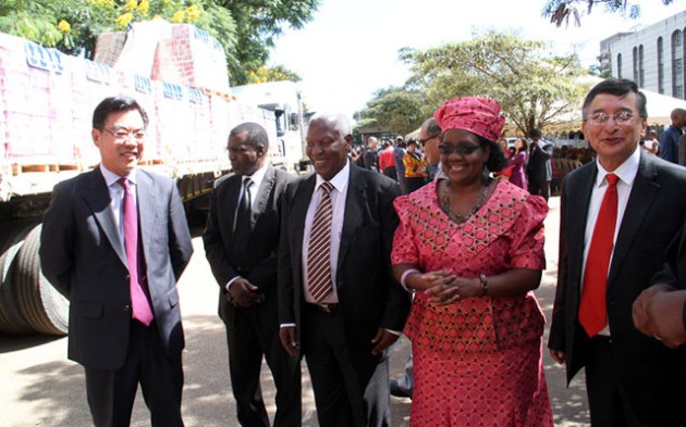 Acting Minister of Local Government, Public Works and National Housing Dr Sydney Sekeramayi, Namibian Ambassador to Zimbabwe Her Excellency Balbina Daes Pienaar, Chinese Ambassador to Zimbabwe Mr Huang Ping and United Nations Resident Coordinator Mr Bishow Parajuli inspect truckloads of fish from Namibia during the handover of donations for flood victims in Harare yesterday. China gave a $1 million cheque to ease the plight of the affected communities. — (Picture by John Manzongo)