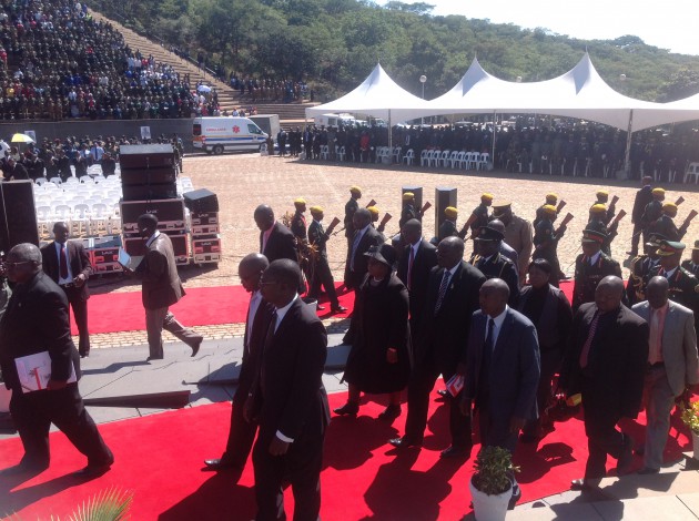 Acting President Joice Mujuru accompanies the body of national hero Brigadier General, Zingoni to the tomb of the unknown soldier (pic by Lloyd Gumbo).jpg