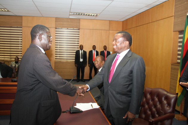 Advocate  Prince Machaya (L) shakes hands with VP Mnangagwa soon after being sworn in. (Pic by William Mafunga)