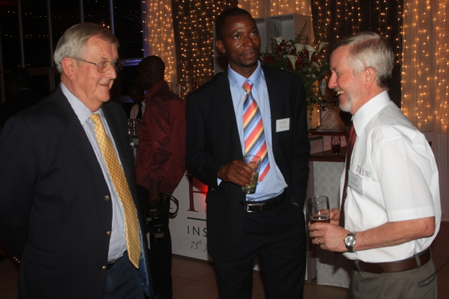 THI Insurance non-executive director Mr David Birch (left), head of operations - (General Insurance) Mr Amon Rupiya (middle) and managing director Mr Hamish MacLean confer during a ceremony to mark the company’s 75th anniversary where the plans to offer more products was revealed