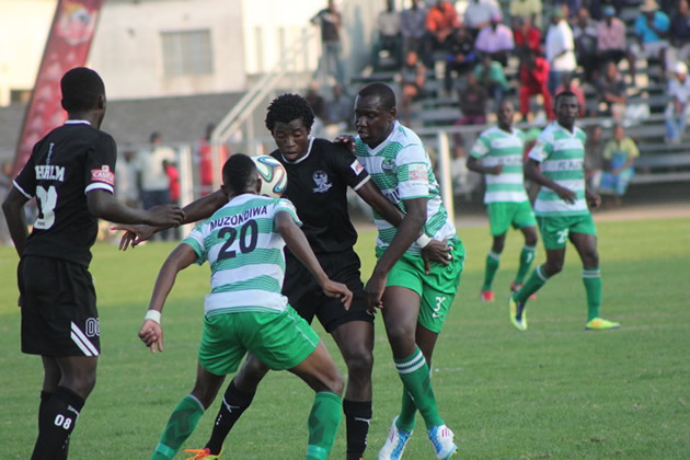 THE BALL IS MINE . . . Tsholotsho’s Gerald Takwara shields the ball away from FC Platinum’s Tarisai Rukanda while Brian Muzondiwa closes in during yesterday’s Castle Lager Premiership tie at Mandava