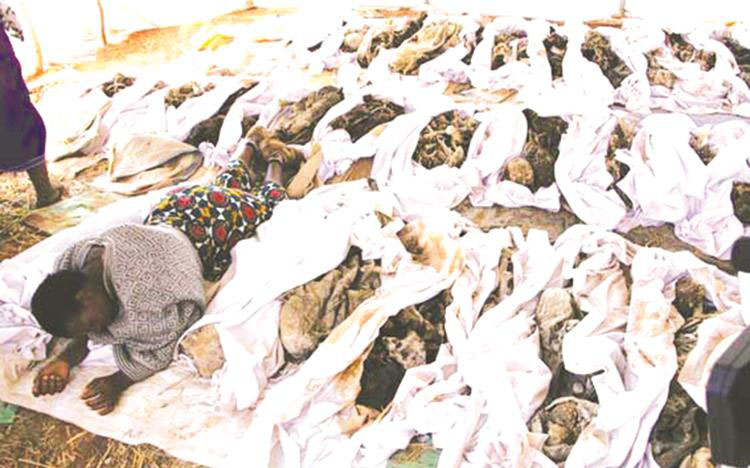 A spirit medium performs a ritual among the remains of freedom fighters killed by Rhodesian security forces during the liberation struggle before the bodies were dumped in disused mineshafts at Chibondo, Mount Darwin, to conceal the atrocities