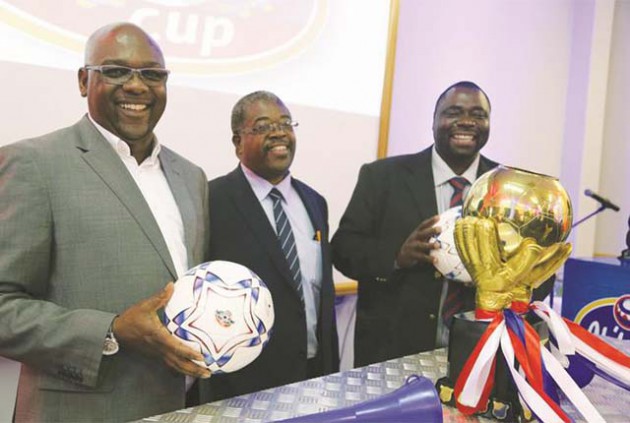 THIS IS IT . . . Delta Corporation marketing director Maxen Karombo (left)  follows proceedings during the Chibuku Super Cup draw with PSL chairman Peter Dube (centre) and PSL chief executive Kenny Ndebele in Harare yesterday