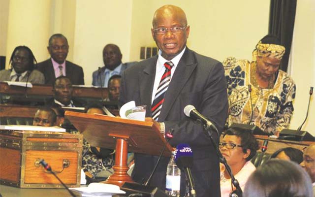 MR SPEAKER SIR . . . Finance Minister Patrick Chinamasa presents the Mid-Year Fiscal Policy Review Statement in the National Assembly yesterday. -(Picture by Tawanda Mudimu)