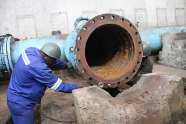 A Harare City worker examines one of the rusty pipes at Morton Jaffray Water Treatment Plant that will be replaced under the China EximBank US$144 million loan facility  