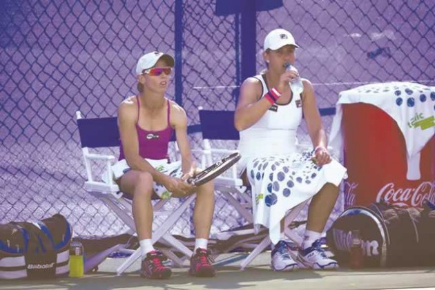 DOUBLE TROUBLE . . . Zimbabwe’s Cara Black (left) and Marina Erakovic of New Zealand rest between sets during their women’s doubles tennis first round match against Dominika Cibulkova of Slovakia and Varvara Lepchenko of the United States  at the Southern California Open at Carlsbad in Southern California, US, on Tuesday night. — AFP