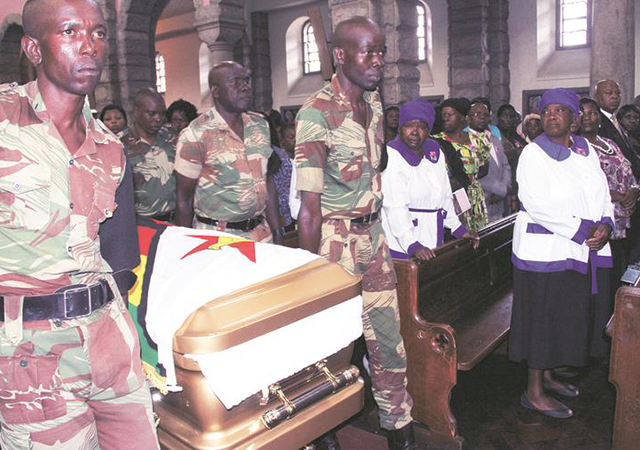 Zimbabwe National Army pallbearers carry the casket with the body of Cde Victoria Chitepo at the Anglican Cathedral during a funeral service in Harare yesterday. — (Picture by John Manzongo)
