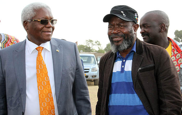 Dr Igntaius Chombo share a lighter moment with Buhera South legislator Cde Joseph Chinotimba ahead of Zanu-PF's rally in Norton on Thursday - Pic by Wilson Kakurira. 