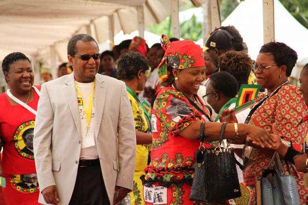 Cde Oppah Muchinguri greets party supporters upon her arrival at the conference