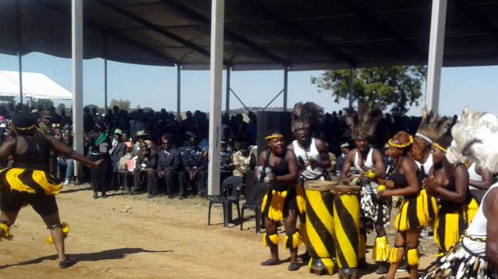 Traditional dance groups are providing entertainment.