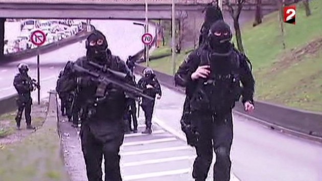 Charlie Hebdo hunt Hostage held as suspects surrounded