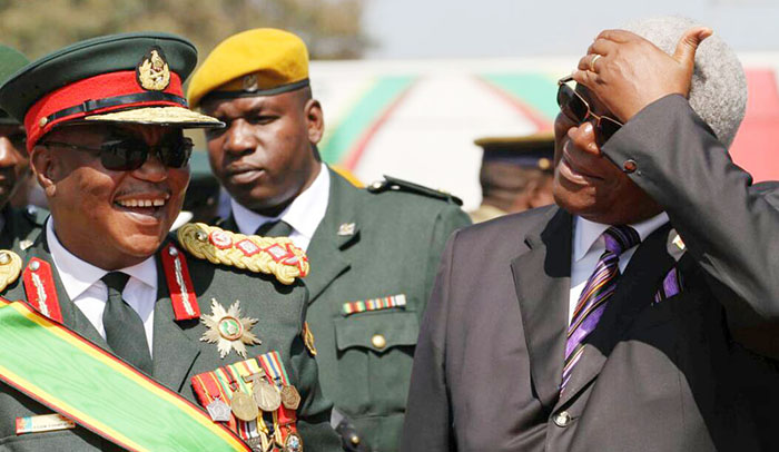General Constantino Guvheya Nyikadzino Chiwenga (l) chats with Dr Ignatius Chombo