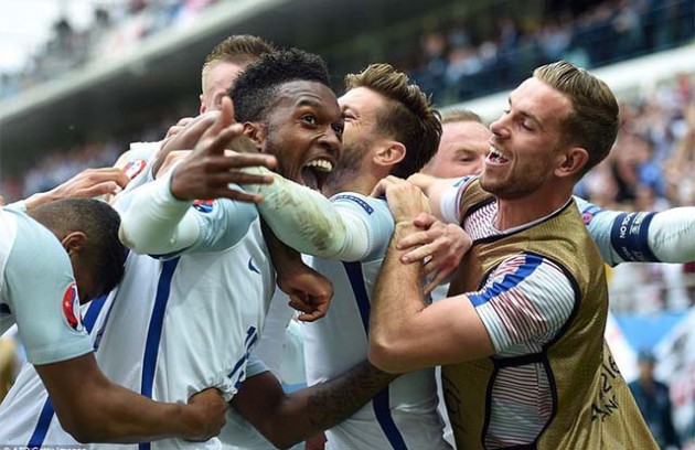 OH YOU BEAUTY! . . . Daniel Sturridge is mobbed by his England team-mates having come off the bench for the second half to find the back of the net in the dying minutes to snatch the winner for the Three Lions in their Euro 2016 match against Wales in Lens yesterday. — Mailonline