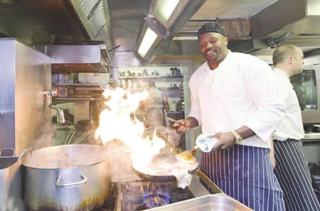 JACK OF ALL TRADES . . . Dereck Chisora relaxes by turning to cooking, sending the signal that he is going to fry Tyson Fury in their eagerly-awaited heavyweight showdown in England. — Mail-online