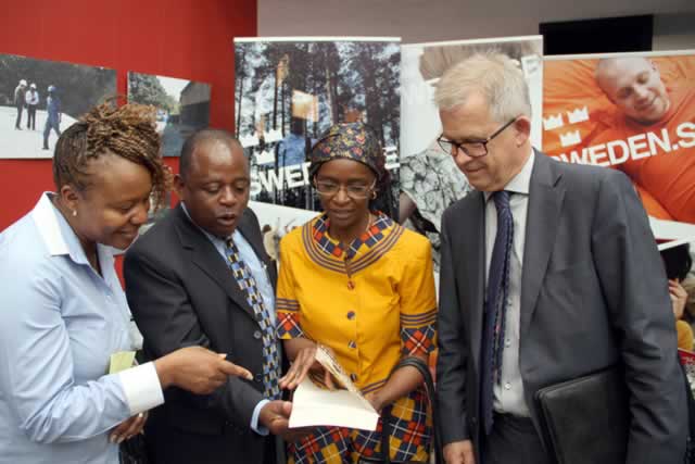 From left: Mrs Maitirwa Mukonoweshuro, Cde Callisto Jokonya, Dr Thokozile Chitepo and Swedish Ambassador to Zimbabwe Mr Lars Ronnas admiring one of the library books.