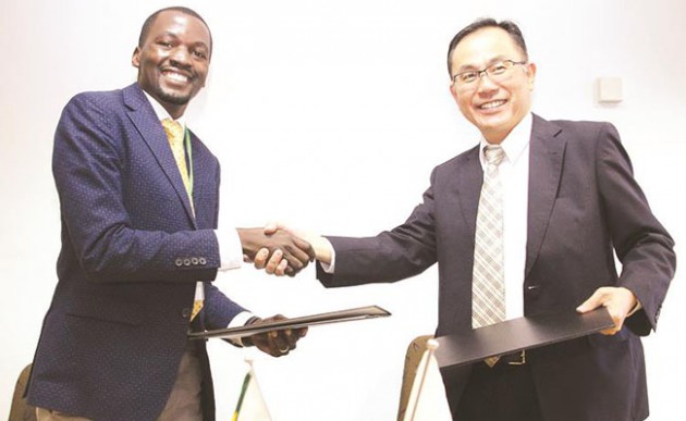Deputy head of mission, Embassy of Japan Mr Dabide Tsunakake shakes hands with executive director of Nhaka Foundation Mr Patrick Makokoro soon after signing grant contracts in Harare yesterday. — (Picture by Innocent Makawa)