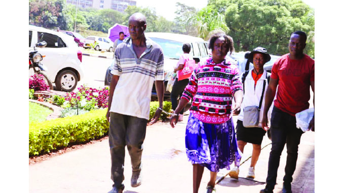 Woman strikes rival with machete
