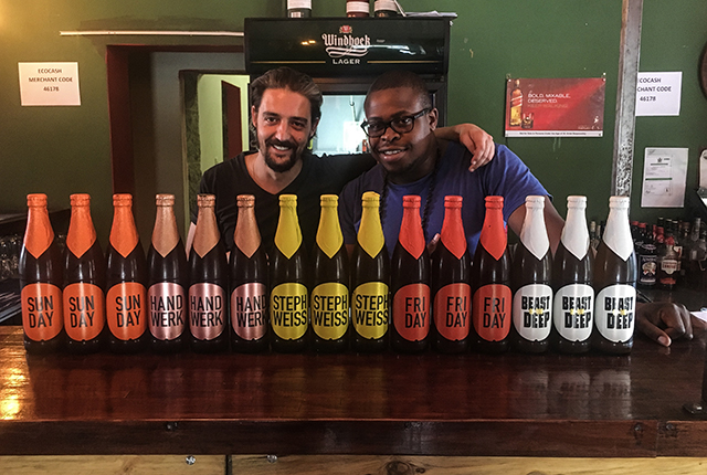 Dimitri and Emmerson with a selection of craft beers on offer