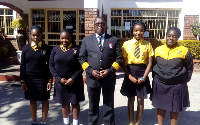 Dr Kundiona(middle) poses with some of his students at UMAA Institute in Marondera