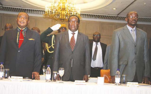 President Mnangagwa and his deputies General Constantino Chiwenga (Retired) (left) and Kembo Mohadi sing the National Anthem at a Davos preparatory business meeting in Harare yesterday