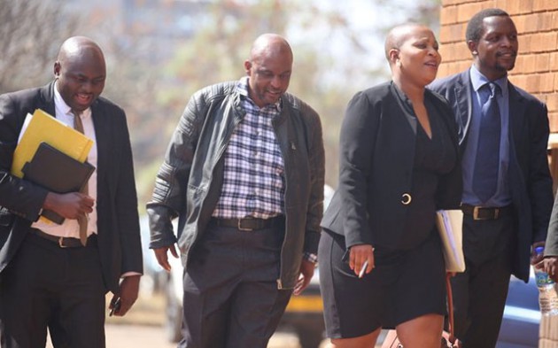 Elias Musakwa (second left) arrives at the Harare Magistrates’ Court in the company of his lawyers yesterday. —  Picture by Lee Maidza.