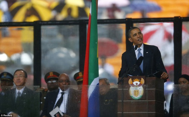 Eulogy:US President Barack Obama delivers his speech at the memorial service for Nelson Mandela at FNB soccer stadium in Johannesburg-Daily Mail