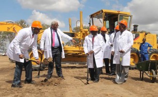 Finance and Economic Development Minister Patrick Chinamasa breaks the ground at Fidelity Life's Southview Park residential project yesterday. On his left is Local Government Minister Dr Ignatius Chombo, Fidelity chief executive Mr Simon Chapereka (centre) and Defence Minister Sydney Sekeramayi.