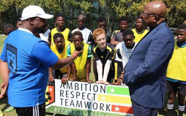 LEGENDS IN THE MAKING . . . Farai Dhliwayo (left) explains to ZIFA president Philip Chiyangwa about the work his academy is doing to develop young talent in Eastlea after the country’s football leader paid a visit to the academy yesterday