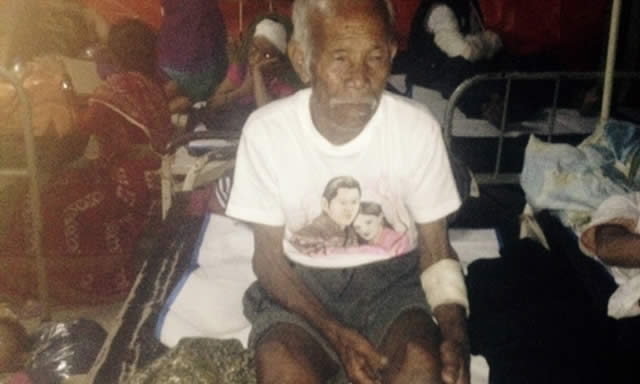 Funchu Tamang sits on a bed in hospital after being pulled out alive from the rubble left by the Nepali earthquake. - AFP/Getty Images