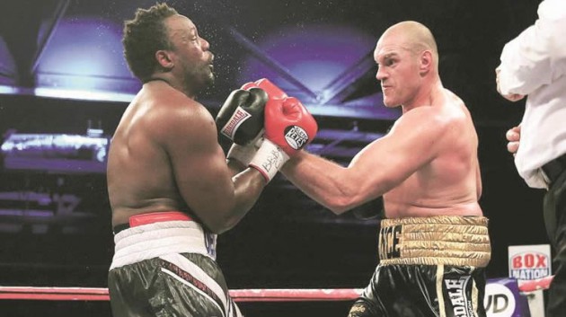 TAKE THAT . . . Tyson Fury (right) lands an uppercut on his way to a decisive victory over Dereck Chisora on Saturday night in London to set himself up for a shot at Wladimir Klitschko next year. —Mailonline
