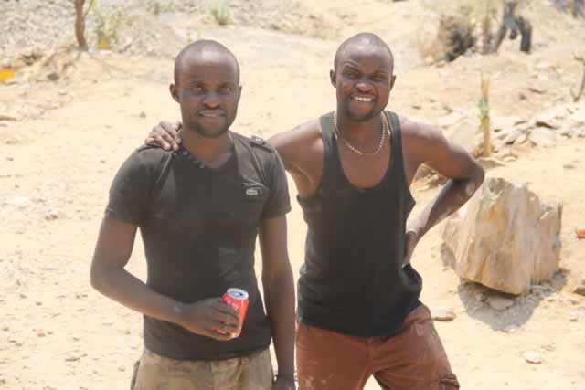 Fichani twins posing at their Zenda gold claim