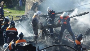 Fire fighters battle to contain a fire, which killed up to 37 people at a Russian psychiatric institution. – RIA Novosti