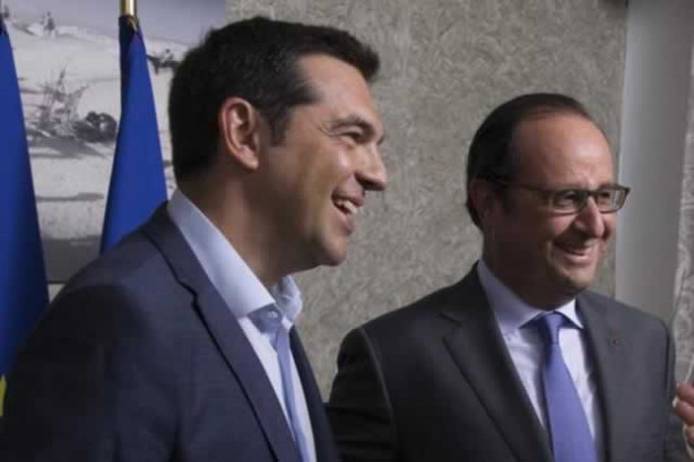 French President Francois Hollande (right) and Greek Prime Minister Alexis Tsipras meet on the occasion of the inauguration of a new Suez Canal waterway, in Ismailia, Egypt last week. - Reuters