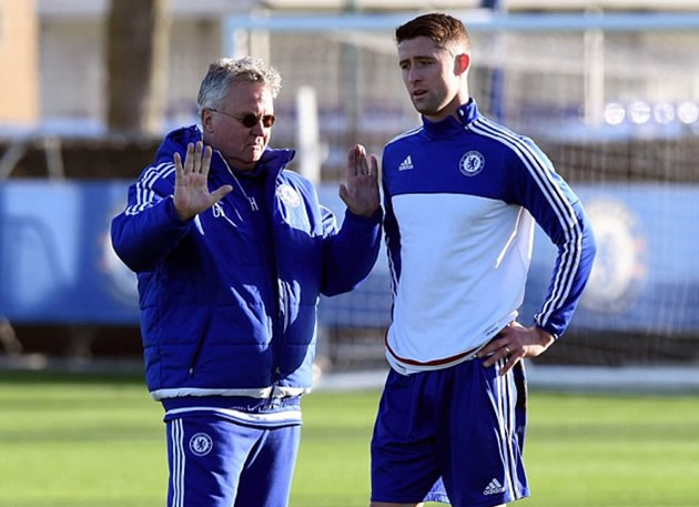 THE NEW MASTER AND HIS PUPIL . . . Guus Hiddink (left) issues instructions to Gary Cahill as he implements his methods on the struggling Chelsea squad yesterday. — Mailonline