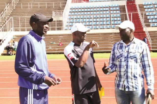 UNDER THE SPOTLIGHT . . . Ian Gorowa (centre) discusses a point with his assistant Callisto Pasuwa (left) and acting team manager Patrick Mutesva during a Warriors training session at the National Sports Stadium