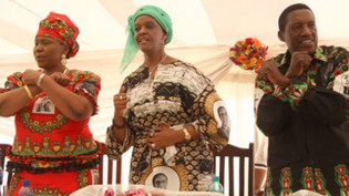 The First Lady Amai Grace Mugabe, flanked by Women's League secretary Cde Oppah Muchinguri and Youth League secretary Cde Absolom Sikhosana (right) lead delegates in singing the popular party song "Chisungo takasunga" to denote their unanimous endorsement of Mai Mugabe’s leadership in Mazowe yesterday. — (Picture by Justin Mutenda)