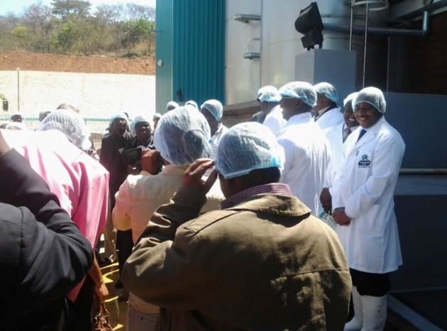 Delegates being briefed on the milk factory  and staff