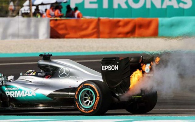 Lewis Hamilton’s Mercedes engine catches fire 15 laps from home in the Malaysian Grand Prix yesterday