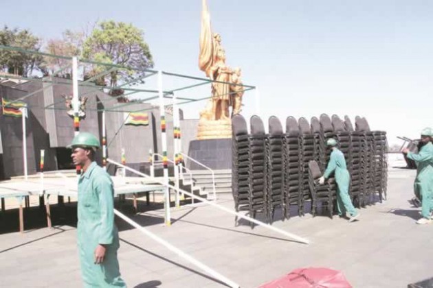 Workers from a hiring servicescompany pitch up tents in preparation for Heroes Day commemorations at the National Heroes Acre in Harare yesterday