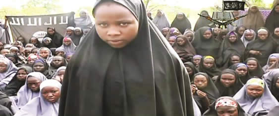 Some of the girls abducted by Boko Haram in a video released yesterday. — AFP