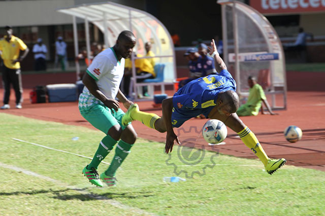 Harare City defender Jimmy Tigere takes a tumble after being shoved off by CAPS United forward Dominic Chungwa - All pictures by Wilson Kakurira