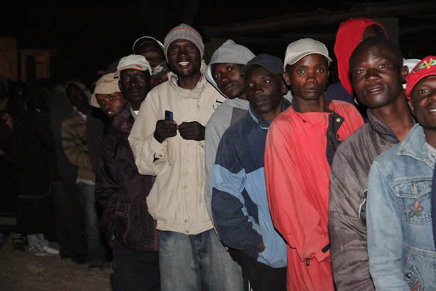 Earlier on . . .Voters waiting impatiently to cast their votes at Caledonia polling station in Goromonzi South (picture by John Manzongo)