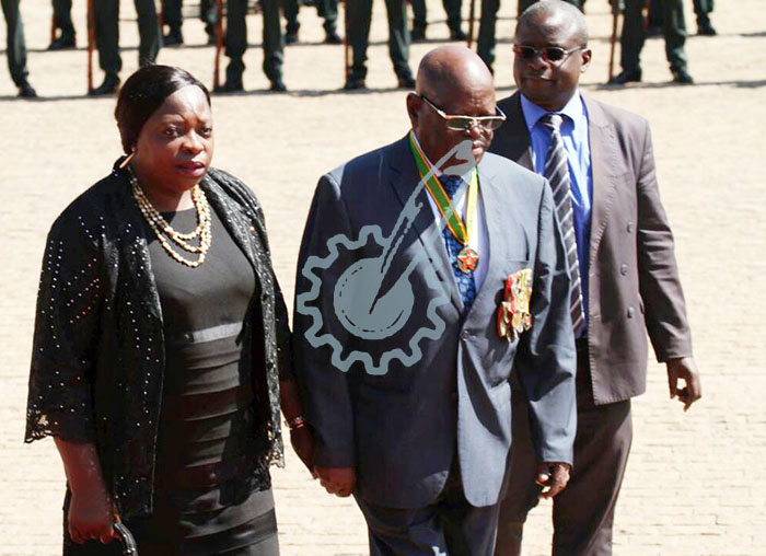 Minister Tshinga Dube (center).