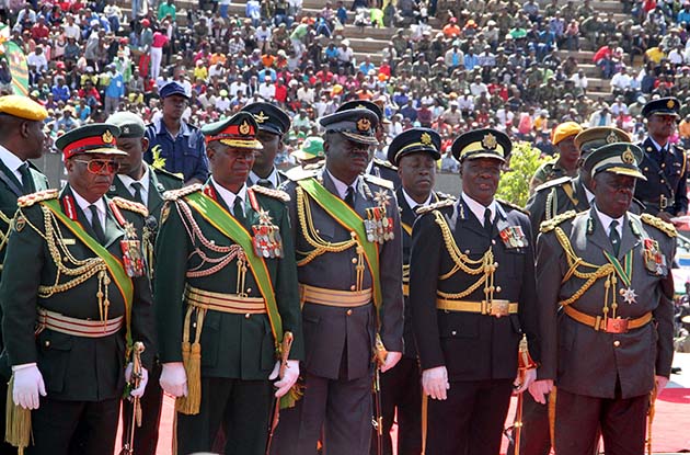 (From Left) Commander of the Defence Forces, General Constantino Guvheya Nyikadzino Chiwenga, Zimbabwe National Army Commander Lieutenant-General Philip Valerio Sibanda, Air Force of Zimbabwe Commander Air Marshall Perrance Shiri, Police Deputy Commissioner-General Levy Sibanda and Commissioner-General of Zimbabwe Prisons and Correctional Services, Retired Major General Paradzai Zimondi follow proceedings during Heroes Day commemorations at National Heroes Acre.-(Picture by Tawanda Mudimu)