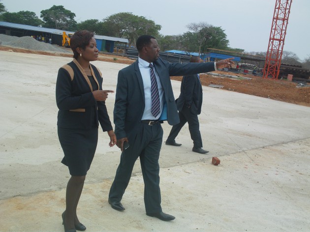 Ministry of Transport and Infrastructural Development permanent secretary Munesuishe Munodawafa shows the ministry's Deputy Minister Petronella Kagonye the airport construction site