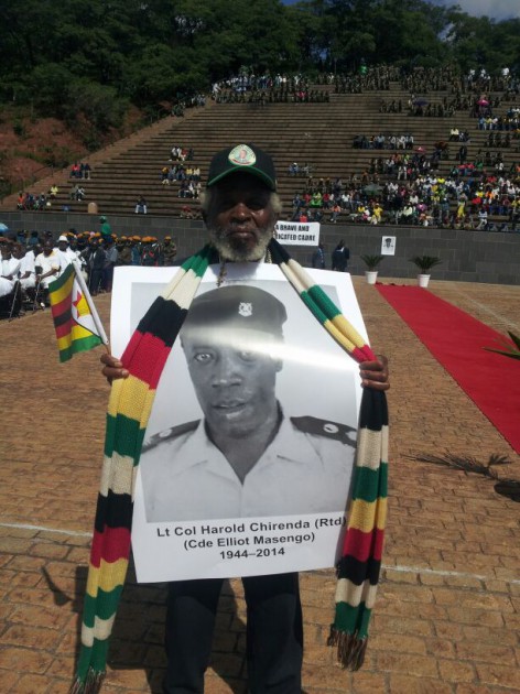 An unidentified man holds an portrait of Cde Chirenda-Pic by Lloyd Gumbo
