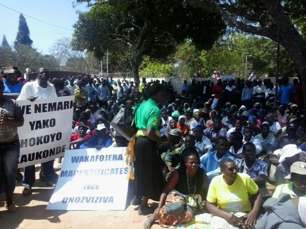 The demonstrators sit in the provincial offices yard. Pic by Farirai Machivenyika