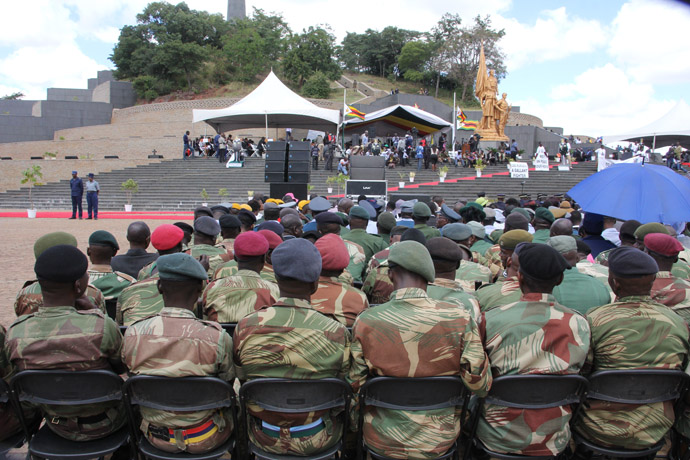 Members of the security forces take in the proceedings