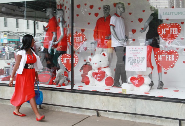 Dressed for the day . . . a woman walks past a beautiful mechandise of valentine designed wear in Harare.